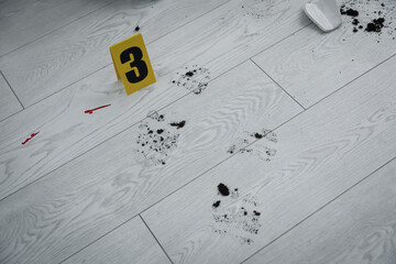 Footprints on wooden floor. Evidence at crime scene