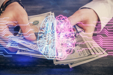 Multi exposure of brain drawing hologram and us dollars bills and man hands. Ai invest concept