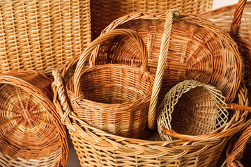 Many different wicker baskets made of natural material as background