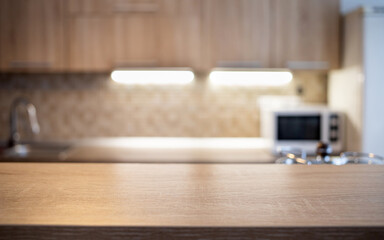 blurred kitchen interior and wooden desk space home background