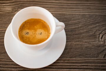 cup of coffee on wooden background