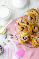 Cinnabon rolls cooling on the grid. 