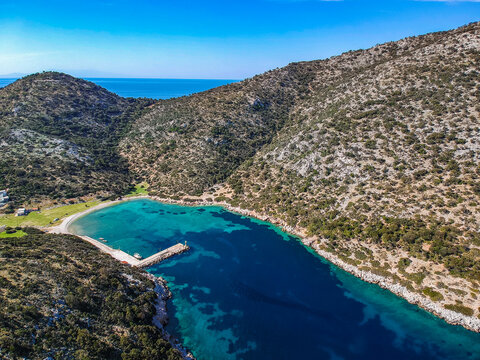 Aerial panoramic view of the picturesque old harbor Gerakas in northern Alonnisos, Greece. Beautiful scenery with rocky formation and natural fjord-like bay in Sporades Aegean sea, Greece