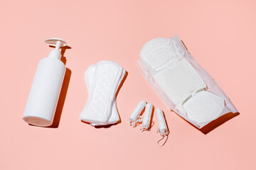 Girl, women intimate hygiene products sanitary pads, daily pads, intimate liquid soap and tampon on...
