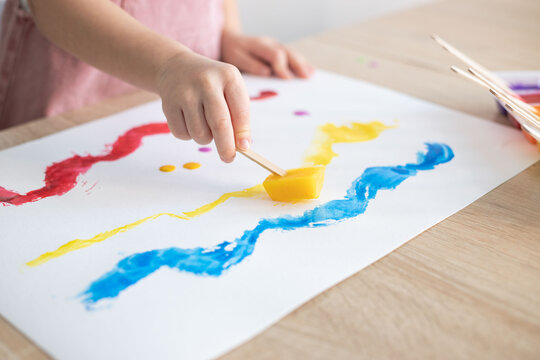 Kid painting with ice paints. Creativity, Diy, homemade activities for toddlers.