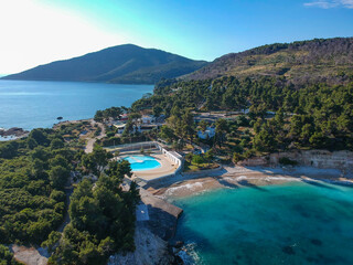 Deserted beach and modern resorts over Marpounda beach in Alonnisos island due to the measures...