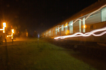 Fototapeta na wymiar Long exposure train with light trails at night