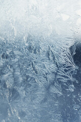 Beautiful frosty window as background, closeup. Winter morning