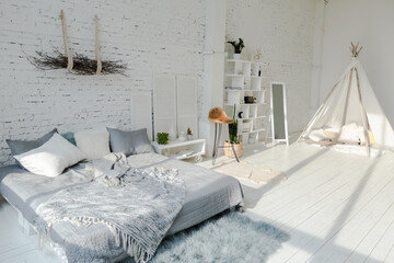 Spacious stylish modern trendy loft apartment in white and light colors. brick wall, wood floor,...