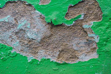 Old dirty painted wall. Several layers of peeling paint. background texture. Horizontal
