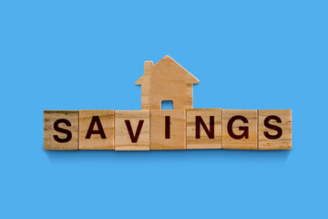 Top view of crossword with words helpful tips. Alphabet blocks with letters on the wooden board.