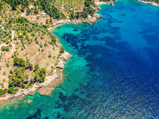 Obraz premium Aerial drone view over Chrisi Milia beach and the rocky surrounded area in Alonnisos island, Sporades, Greece