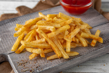 French fries. Golden, delicious, crispy and hearty. Fast food.