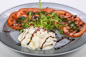 Strachatella cheese with tomato and rucola