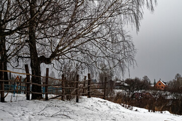 Naklejka premium wooden cemetery fence in winter