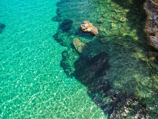 Aerial drone view over Chrisi Milia beach and the rocky surrounded area in Alonnisos island, Sporades, Greece