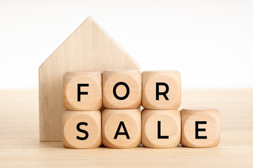For Sale concept. Real estate market. Wooden blocks with text and house icon. Copy space