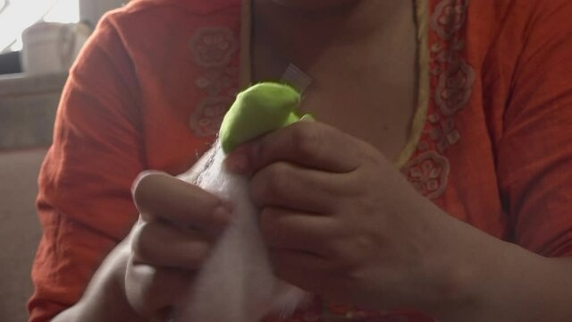 Woman Stuffing Cotton Inside Cloth Toy, Kathmandu, Bagmati Province, Nepal