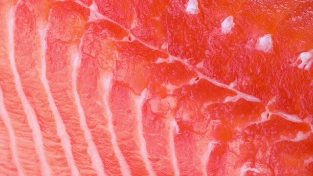 Close-up of slices of fresh raw red salmon