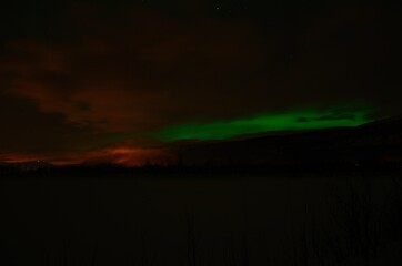 aurora borealis, northern light on winter night sky in northern Norway