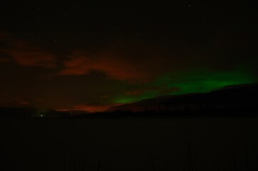 aurora borealis, northern light on winter night sky in northern Norway