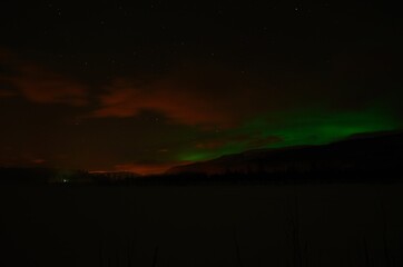 Fototapeta na wymiar aurora borealis, northern light on winter night sky in northern Norway