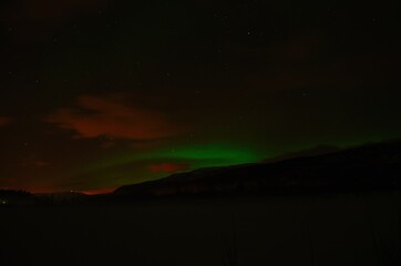 Fototapeta na wymiar aurora borealis, northern light on winter night sky in northern Norway