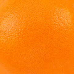 Orange fruit texture as a  background, top view.  Summer wallpaper