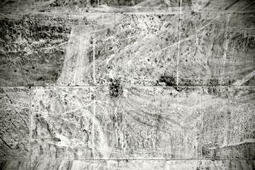 Stone wall layer background in black and white. Rough wall texture.