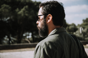 Man with beard outside nature