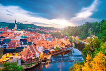 Fototapeta na wymiar Cityscape of traditional czech small houses surrounded by river