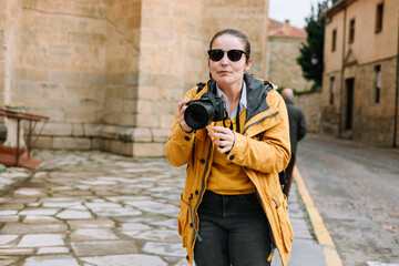 Girl in yellow jacket street photography Spain