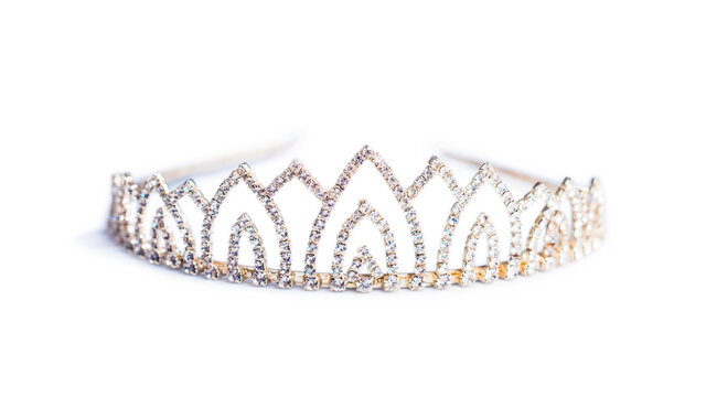 Closeup of crown decorated with shiny gems isolated on white background
