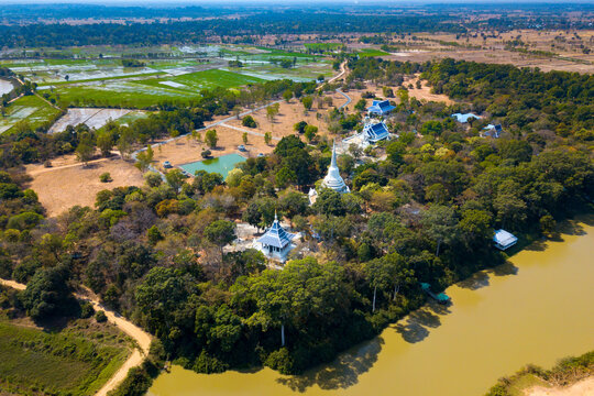 Top view from flying drone over Wat Phra phut tha bat,temple and pagoda  in Mahashanachai town, Yasothon  province,Thailand,ASIA.