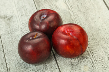 Ripe sweet plum fruit heap
