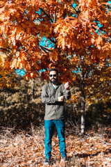 Young man outside in autumn nature