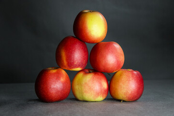 Colorful fruit on a gray background.