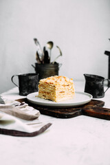 Napoleon cake in a plate on the table