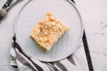 Napoleon cake in a plate on the table