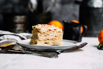 Napoleon cake in a plate on the table