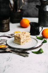 Napoleon cake in a plate on the table