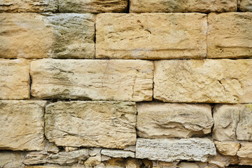 Background texture of a stone wall photo. Natural stone wall texture for the background. Old brick texture