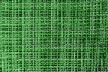 Texture of a green wicker surface. Green background for text and design. Braided texture