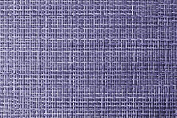 Texture of a purple wicker surface. Purple background for text and design. Braided texture