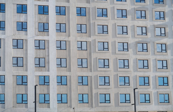 The Blue Sky Is Reflected In The Same Windows On The Facades Of The Office Building, Urban Background