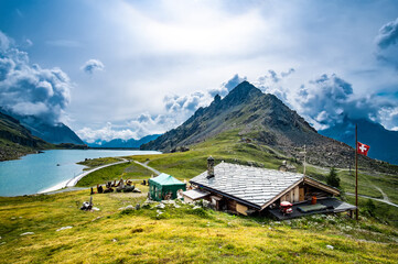 Fototapeta na wymiar Panoramic view on house, mountains and lake
