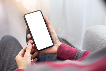cell phone blank white screen mockup.woman hand holding texting using mobile on desk at office.background empty space for advertise.work people contact marketing business,technology