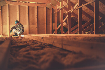 Construction Worker and the Wooden House Attic - obrazy, fototapety, plakaty