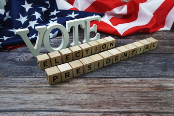 Fototapeta na wymiar Vote Election Presidential Word alphabet letters with USA flag on wooden background