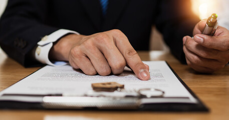 Check and read contract thoroughly before signing, close up hand of businessman reading and...